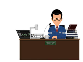 An engineering lecturer is working on his desk