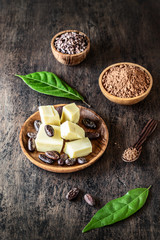 Cacao products on old rustic background.