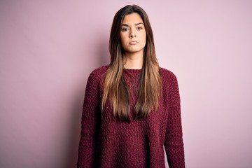Fototapeta premium Young beautiful girl wearing casual sweater over isolated pink background depressed and worry for distress, crying angry and afraid. Sad expression.