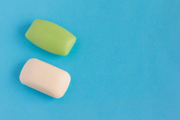 Hand soap on a blue background. Two pieces of soap with copy space