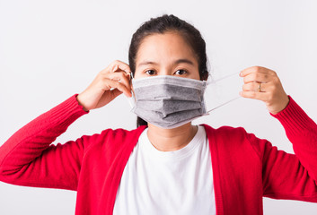 Closeup of portrait Asian adult woman wearing red shirt and face mask protective against...