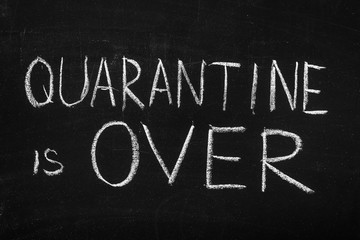 Obraz premium Chalkboard text message Quarantine is over. After coronavirus outbreak