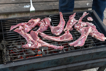 Lamb roasting on the grill.