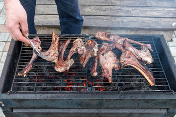 Lamb roasting on the grill.