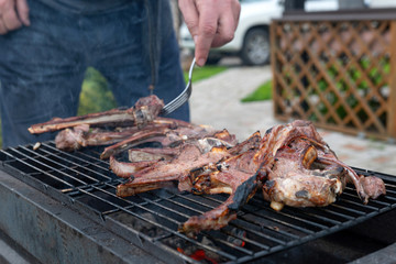 Coronavirus isolation in Russia. Lamb roasting on the grill.