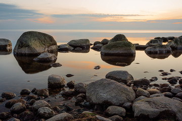 City Tuja, Latvia. Baltic sea with rocks and sunshine. Travel photo.