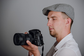 Young man using a professional camera