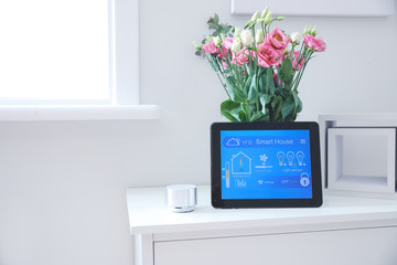 Tablet computer with application of smart home automation and assistant device in room