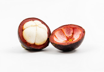 mangosteen fruits placed on a white background.