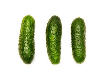 Three cucumbers on a white background