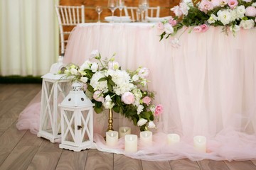 Main table at a wedding reception with beautiful flowers
