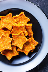 Carrot Stars cookies on a black plate