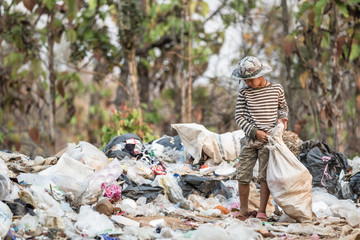 Poor children collect garbage for sale.and recycle them in landfills, the lives and lifestyles of the poor, Child labor, Poverty and Environment Concepts