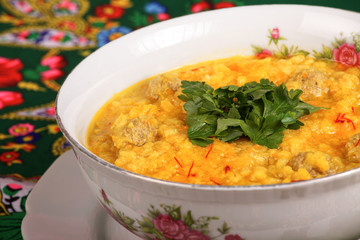 Barley soup with meat and parsley 