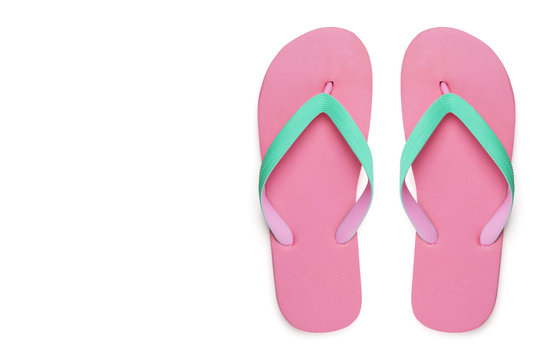 Pink flip flops or slippers isolated on white background with clipping path left copy space, top view