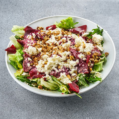 Salad with feta cheese, beetroot and walnuts.