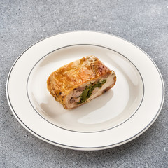 Roulade of chicken. Chicken breast stuffed with herbs.