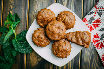 homemade cakes, chocolate muffins with mint and tea with lemon