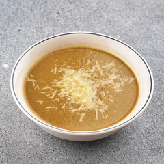 Mushroom soup with cheese. Vegetarian cream soup with mushrooms and cheese.