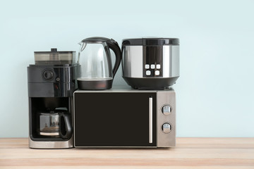 Different household appliances on table