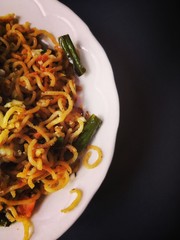 Noodles on a white plate.