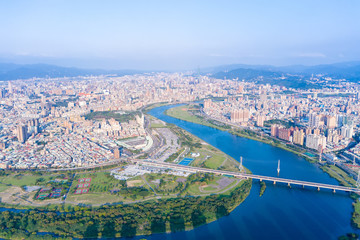 Fototapeta premium Taipei City Aerial View - Asia business concept image, panoramic modern cityscape building bird’s eye view under daytime and blue sky, shot in Taipei, Taiwan.