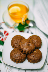 homemade cakes, chocolate muffins with mint and tea with lemon