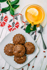 homemade cakes, chocolate muffins with mint and tea with lemon