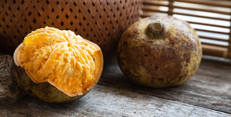 exotic Indian Bel fruit or wooden Apple. Bel fruit slices on wooden rustic background. natural detox. vitamins for immunity