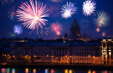 Fototapeta na wymiar St. Isaac's Cathedral over Neva river during fireworks on background Saint Petersburg, Russia