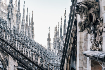 Naklejka premium Luxurious, highly detailed statues decorated roof of the Duomo Cathedral