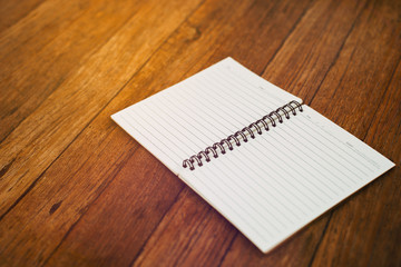 blank notebook on wooden table