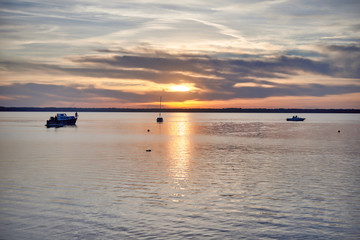 Red sunset over the lake in mid-summer