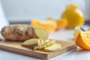 Jar of jam from orange, lemon with honey and ginger and slices of lemon and orange 