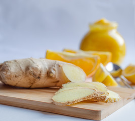 Jar of jam from orange, lemon with honey and ginger and slices of lemon and orange