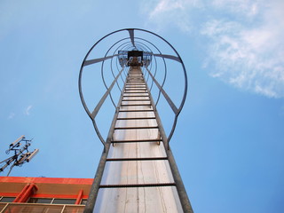 The stairway on the light pillar For climbing up to the light pole for maintenance and resting on the way up. Selective focus