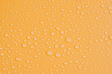 Abstract  Random of drop of water on orange PVC background