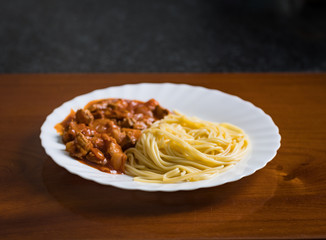 Spaghetti with pork in tomato sause