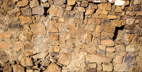 Texture image of an old stone wall on a rural farm