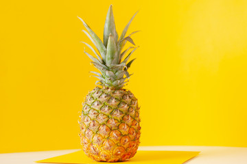Whole Pineapple on Yellow Background, large plan