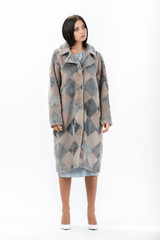 girl in a fur coat on a white background for a catalog