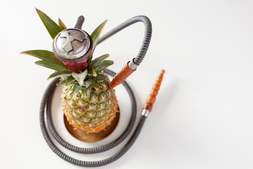 shisha of ripe pineapple fruit on a white table, shisha