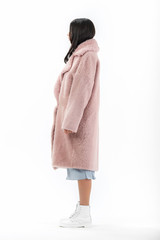 girl in a fur coat on a white background for a catalog
