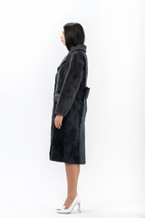 girl in a fur coat on a white background for a catalog