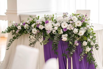Main table at a wedding reception with beautiful flowers