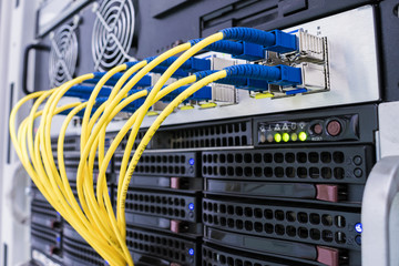 High-speed data transfer in a fiber-optic network. Communication equipment in the server room of...