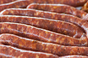 Sausages for barbecue. Fresh raw sausages for grilling. Pork sausages. Fresh minced meat in the gut