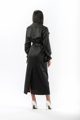 Fototapeta premium brunette posing in clothes for a catalog on a white background