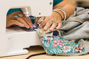 woman sewing a sewing machine