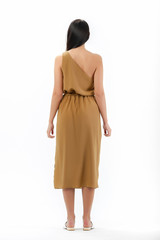 brunette posing in clothes for a catalog on a white background